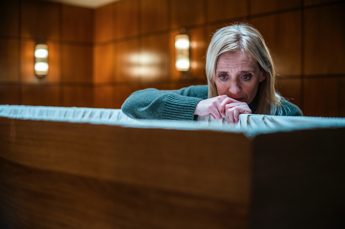 Susannah in Suspect pictured looking in a coffin