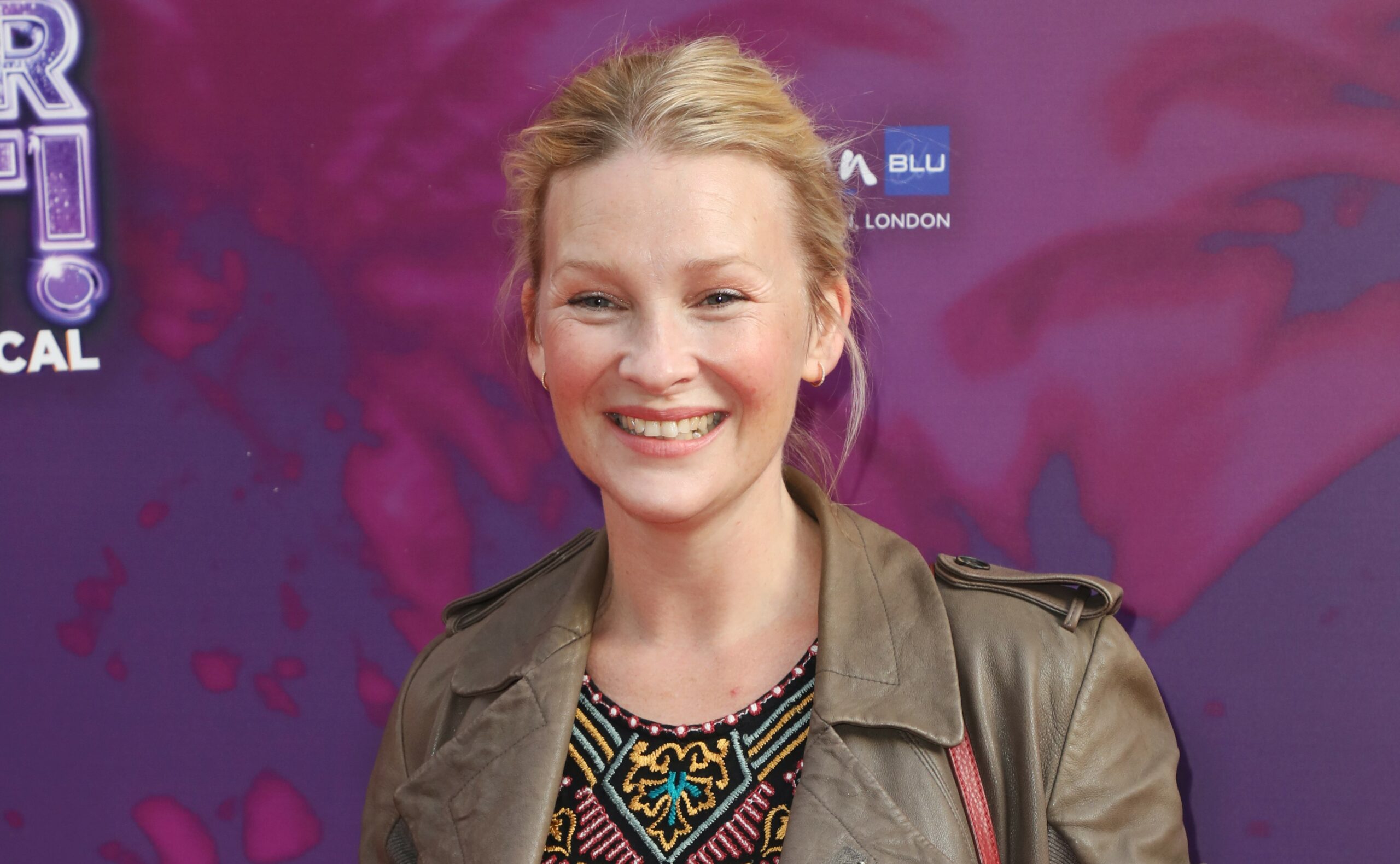 Joanna Page smiles on red carpet