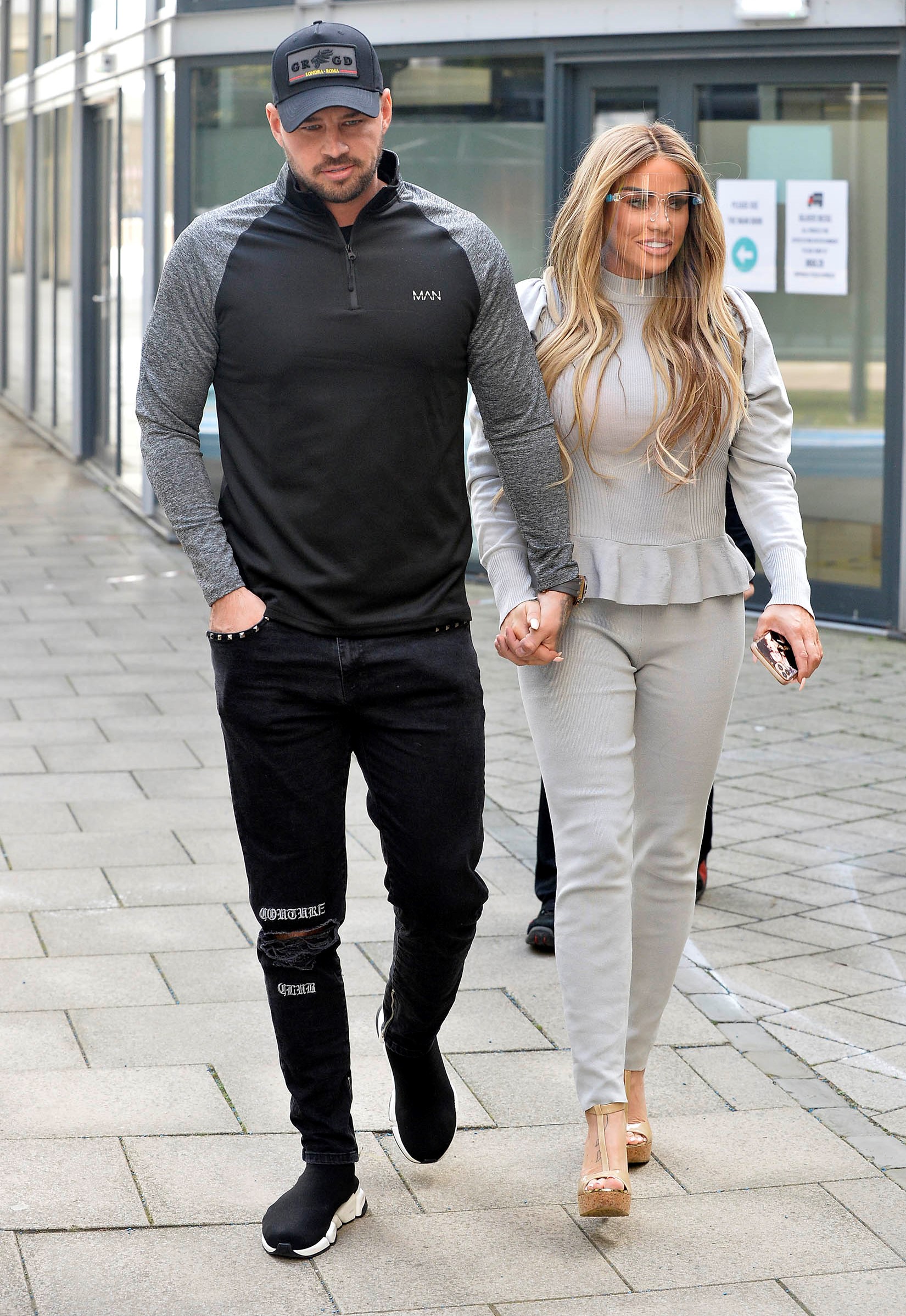 Carl Woods and Katie price hold hands