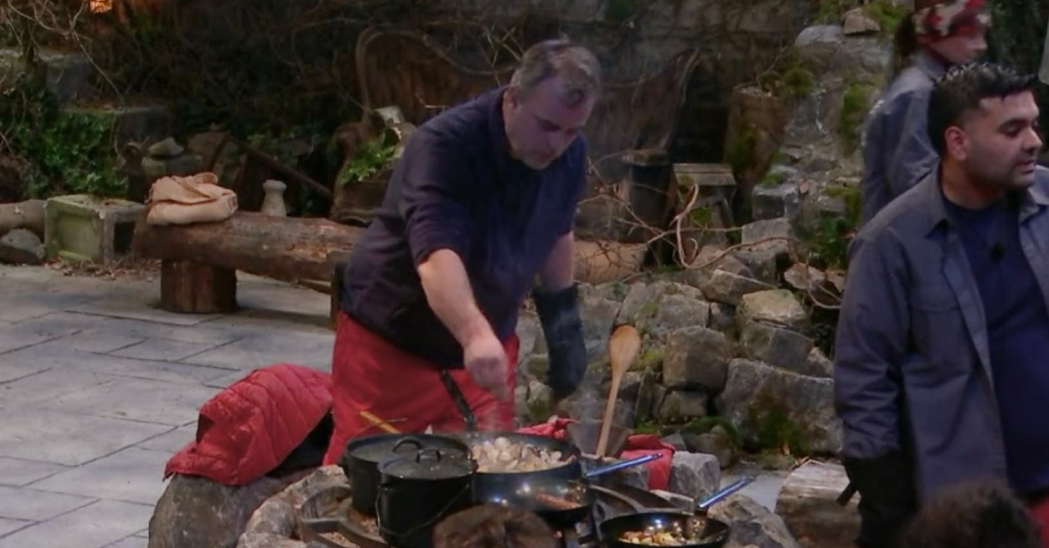 simon gregson sprinkling some salt on sausges on I'm A Celebrity - 2:12:21