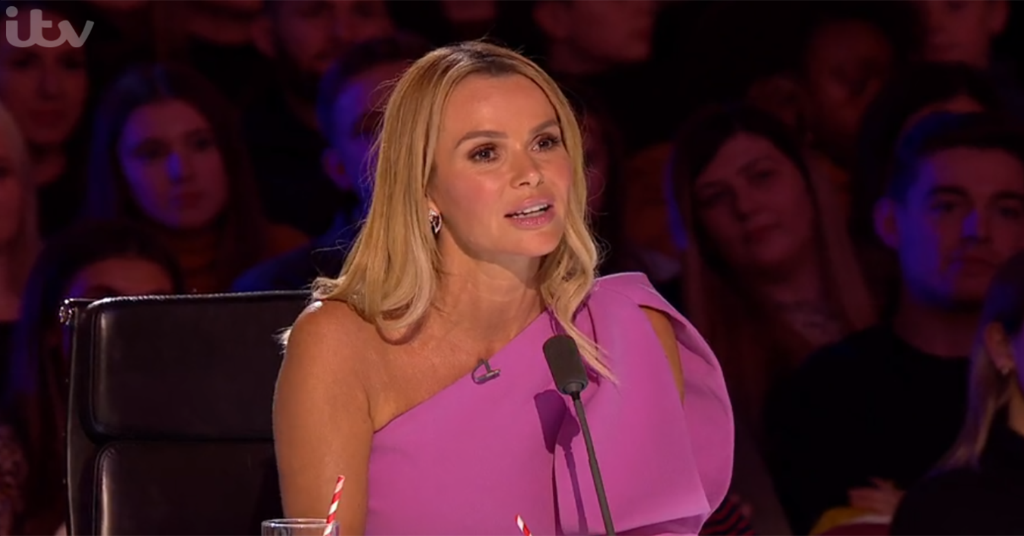 Amanda holden in a pink dress judging on Britain's Got Talent