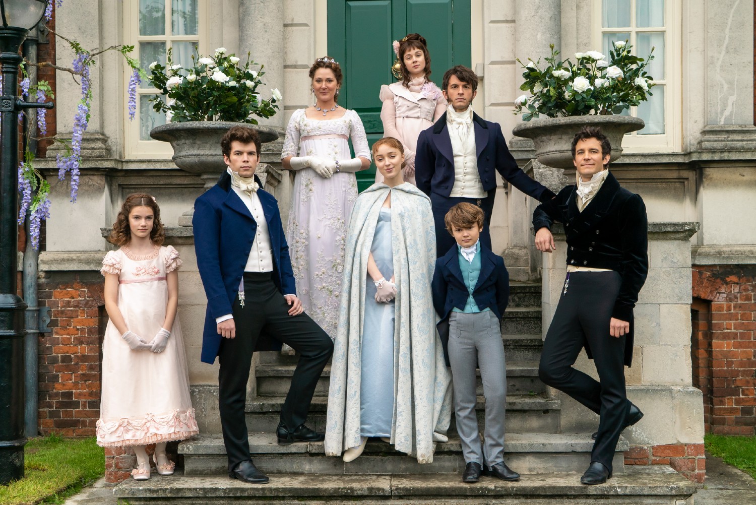 The Bridgerton family standing outside their house