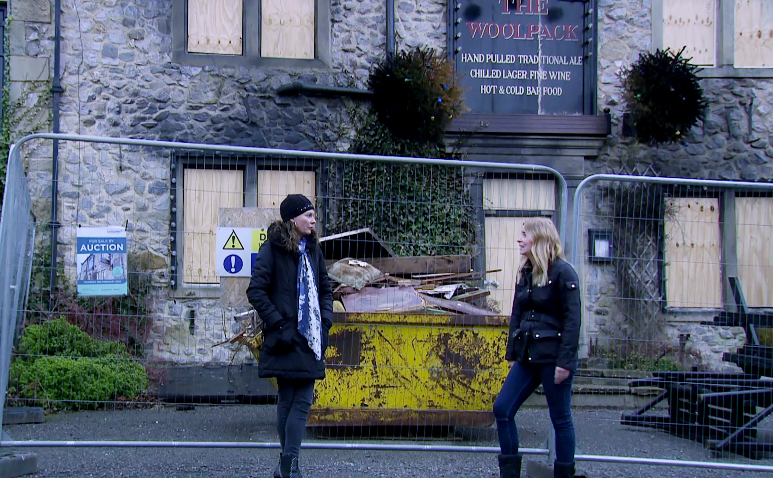Chas and Charity stand outside the Woolpack in Emmerdale