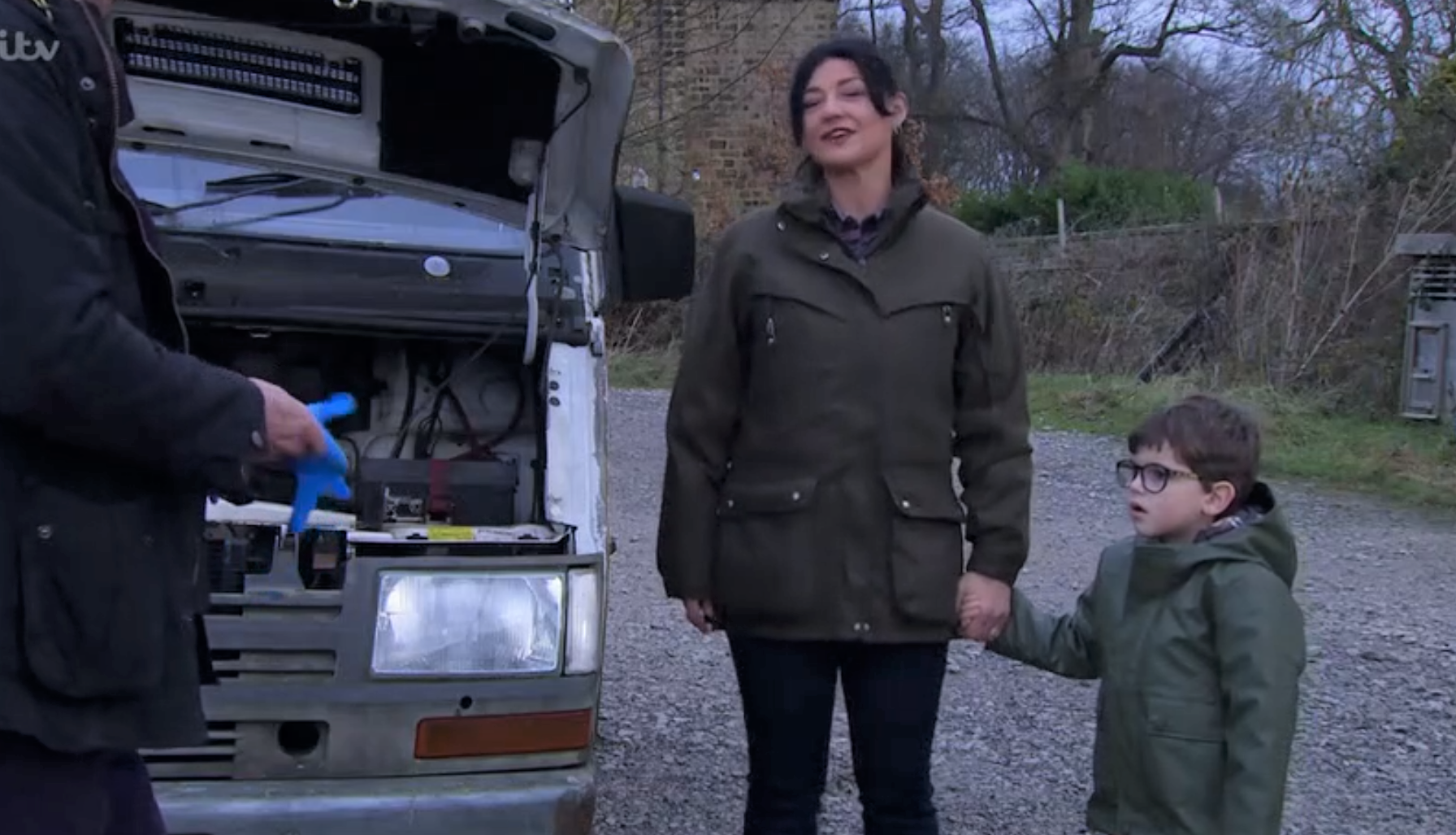 Emmerdale Moira holds hands with Isaac as they talk to Cain