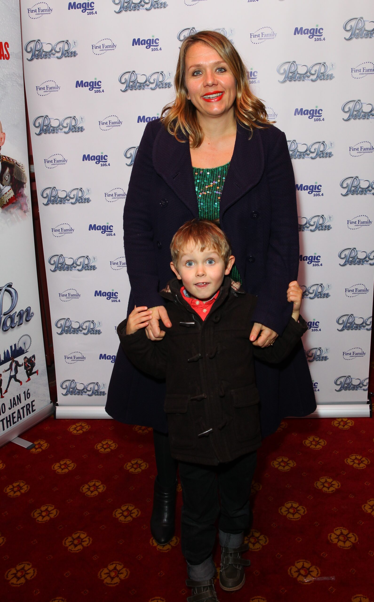 Kerry smiles as attends a press night with son Frank in 2015