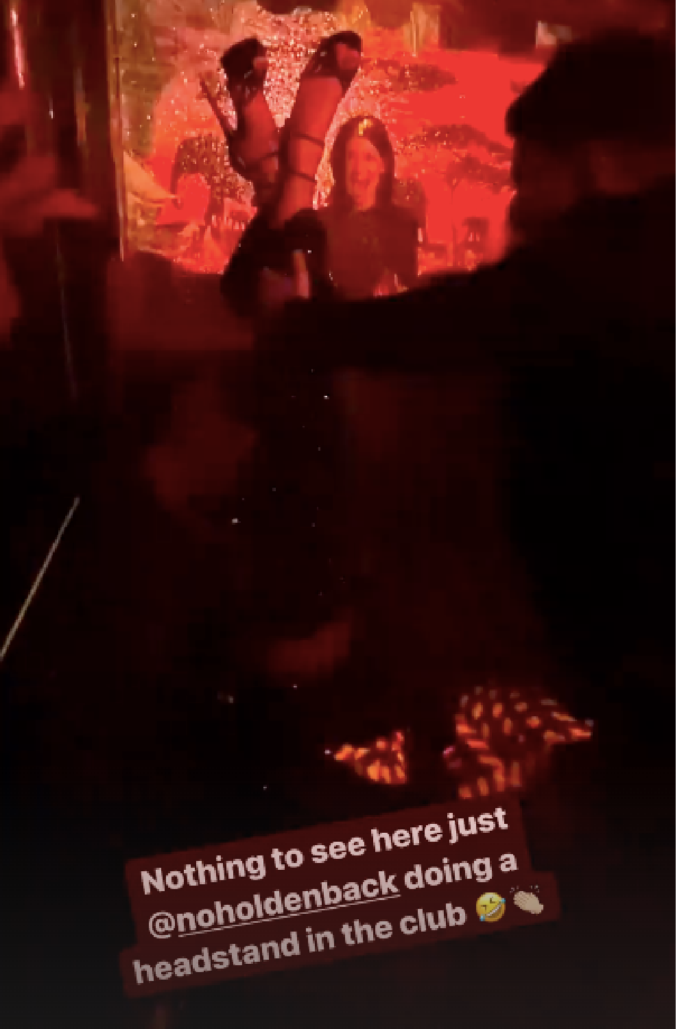 Amanda Holden does a handstand in a nightclub