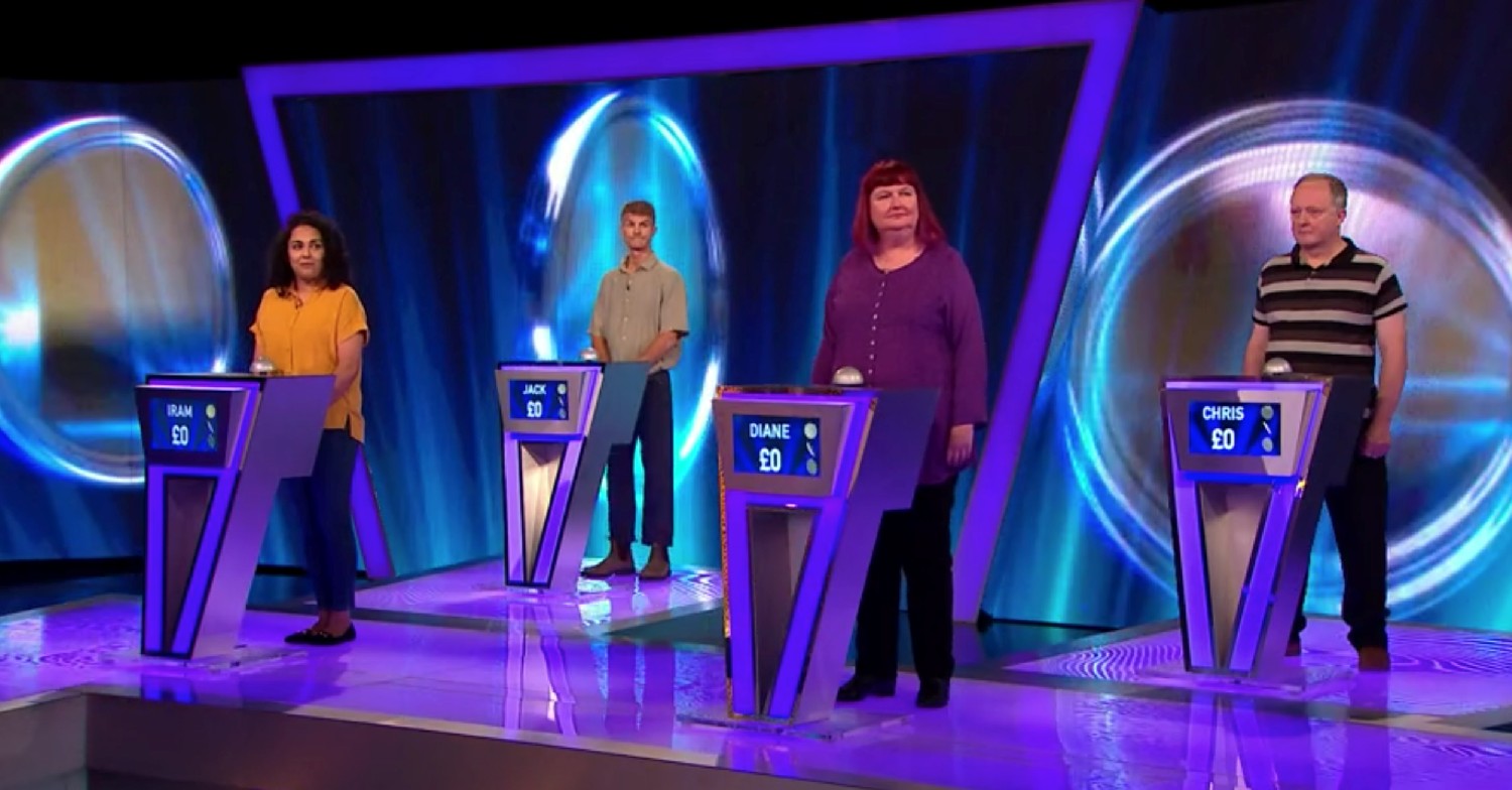 Tipping Point contestants standing at podiums on ITV