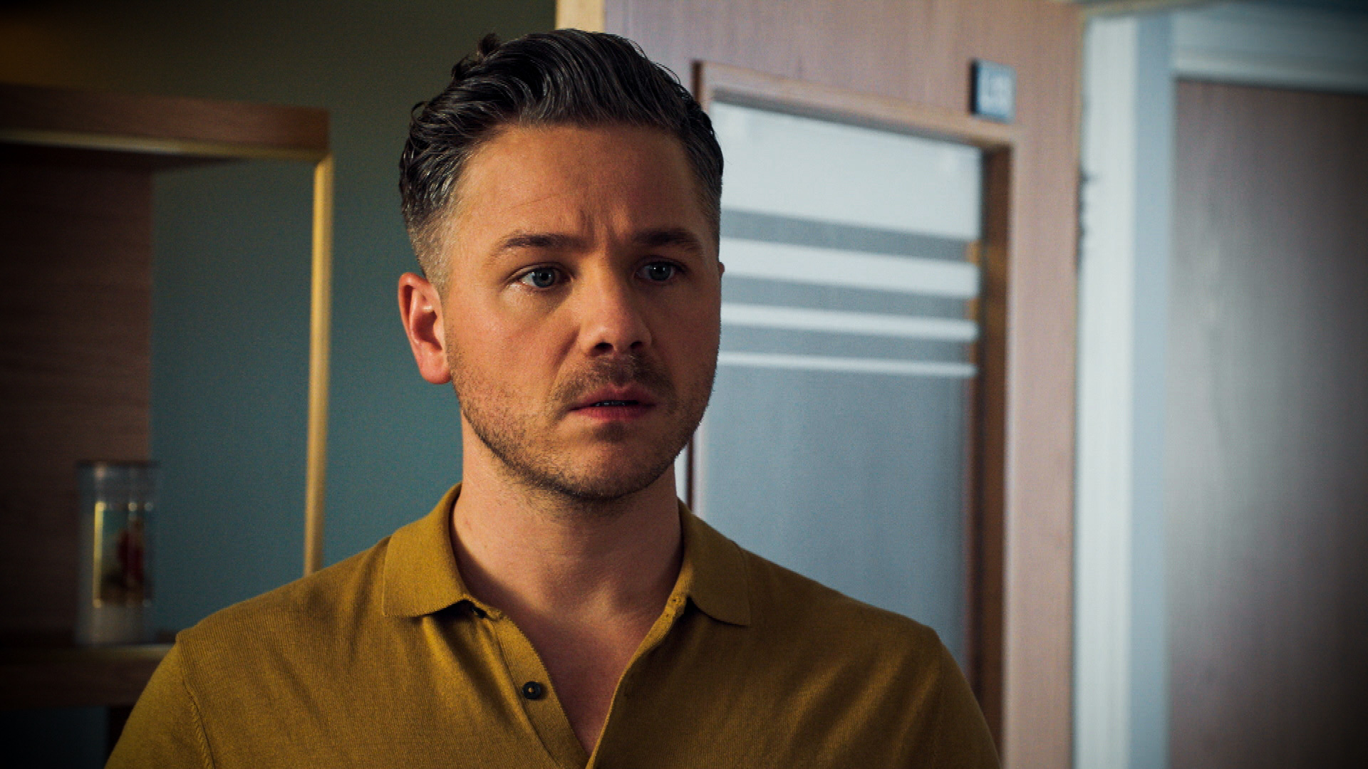Dominic looking shocked on Holby City