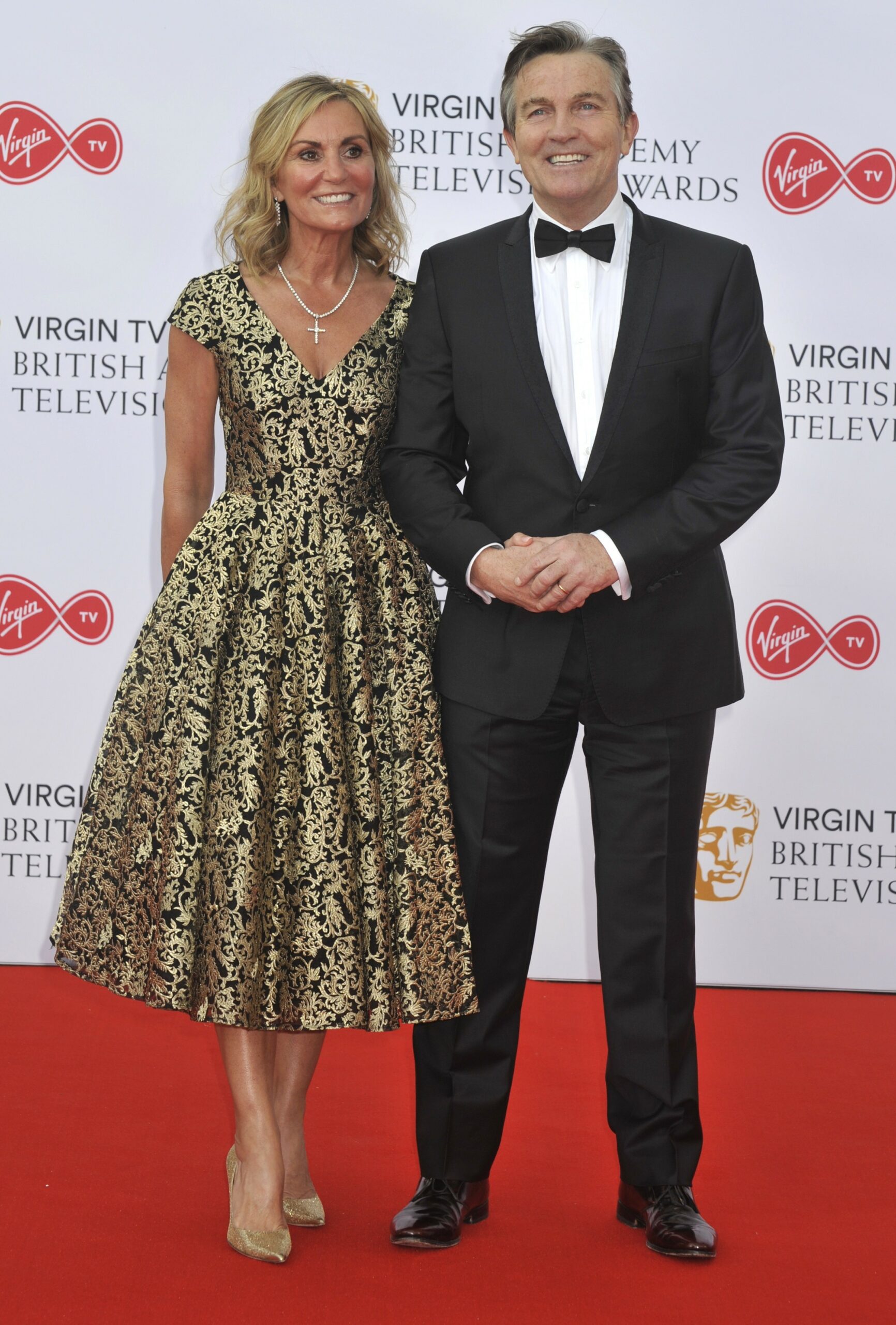 Bradley Walsh and his wife Donna link arms on red carpet at Virgin TV Awards