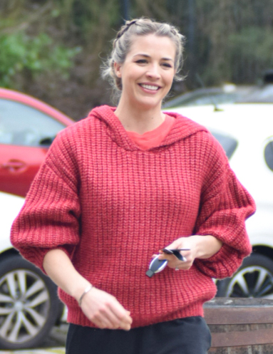 Gemma Atkinson smiling as she walks to her car