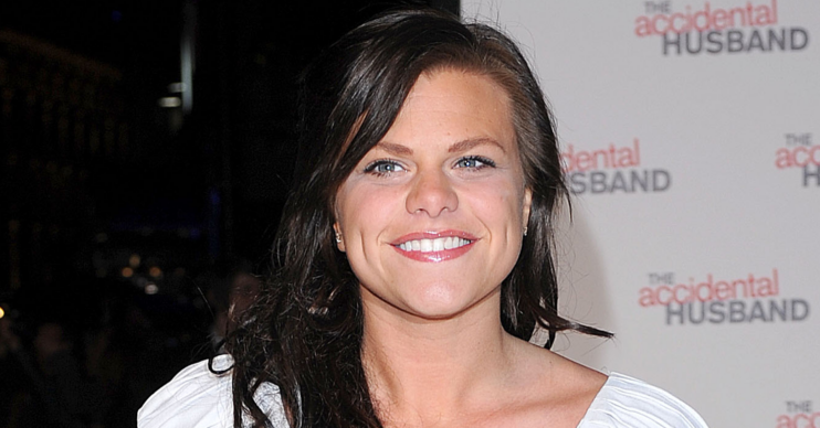 jade goody smiling on the red carpet