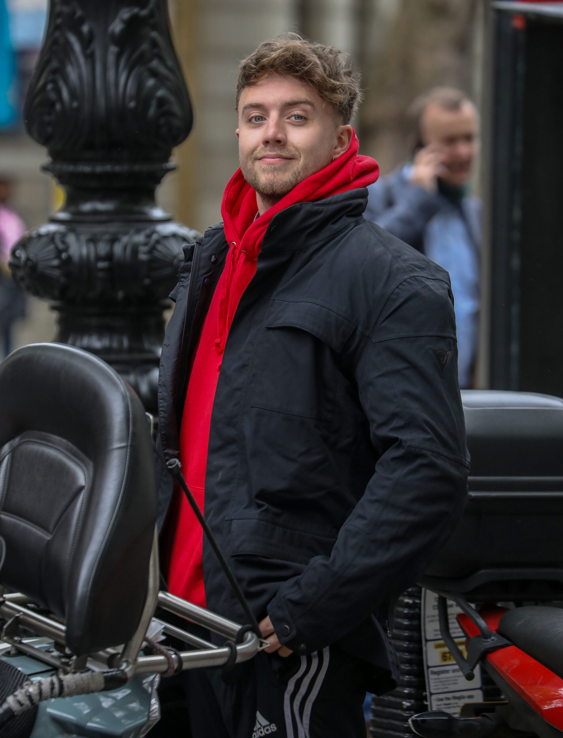 Roman Kemp in a red scarf