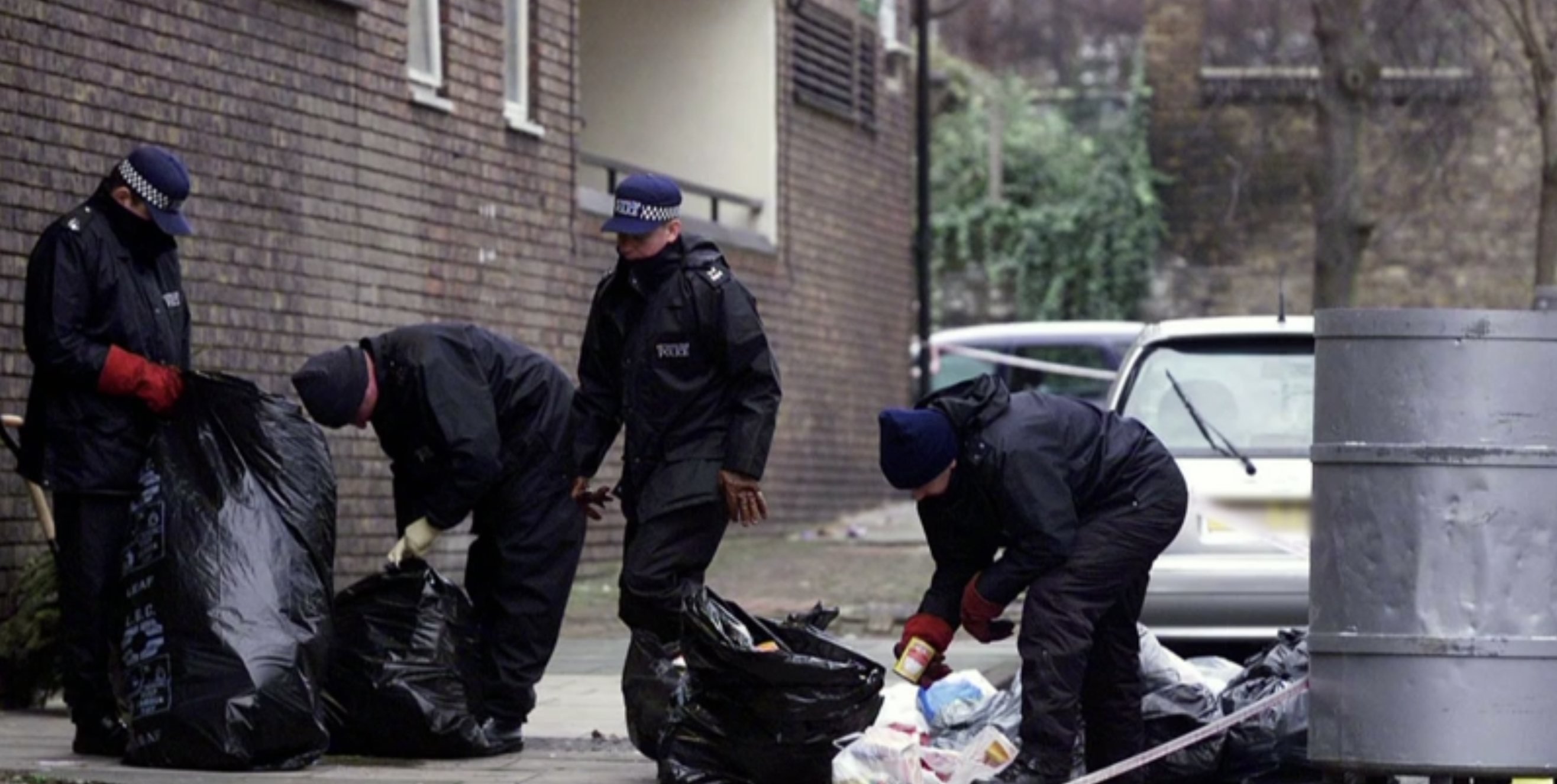 Police going through black bin bags