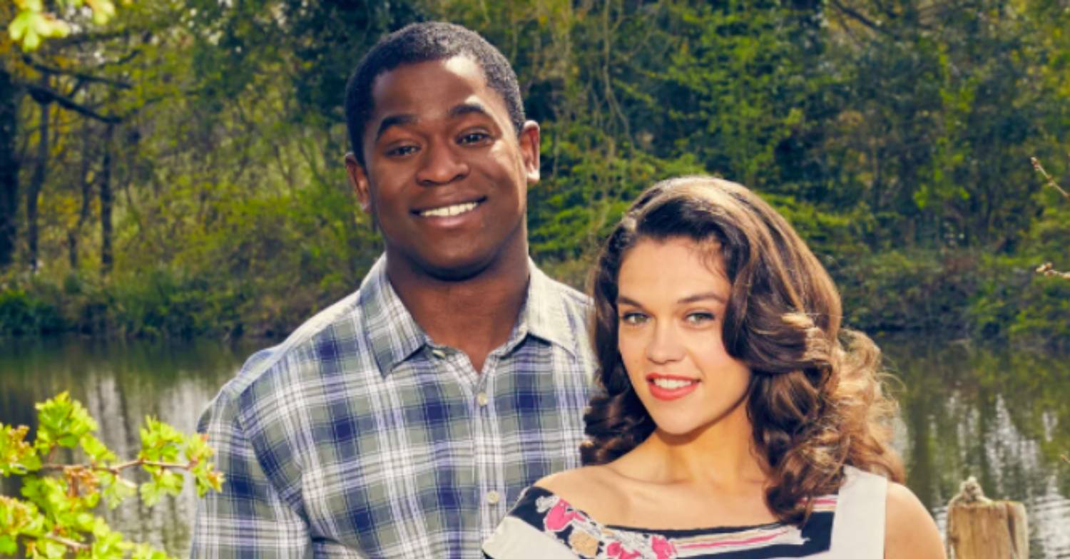 Sabrina Bartlett smiling as Mariette Larkin with Tok Stephen as Charley