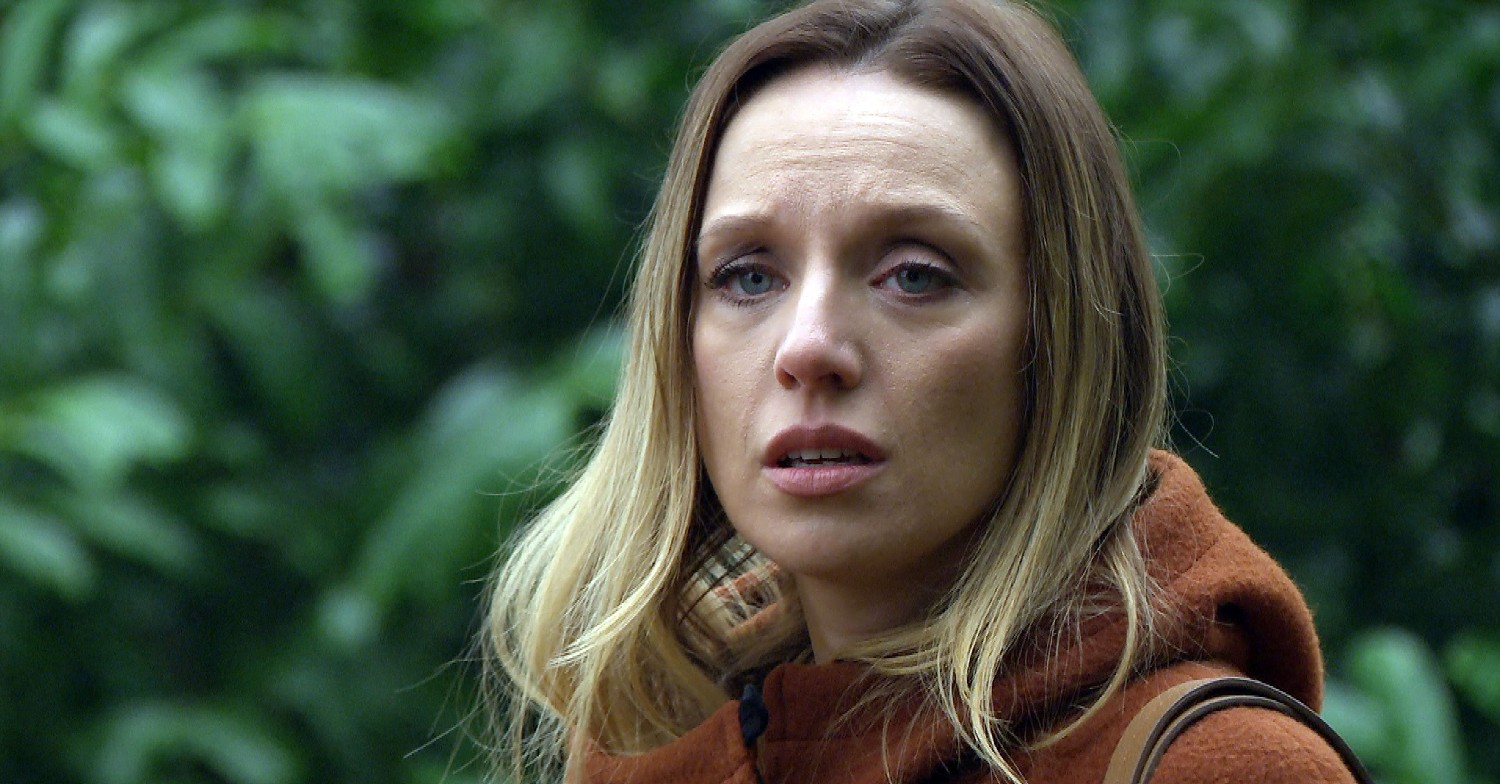 Andrea looking at something off-camera frightened (Credit: ITV)