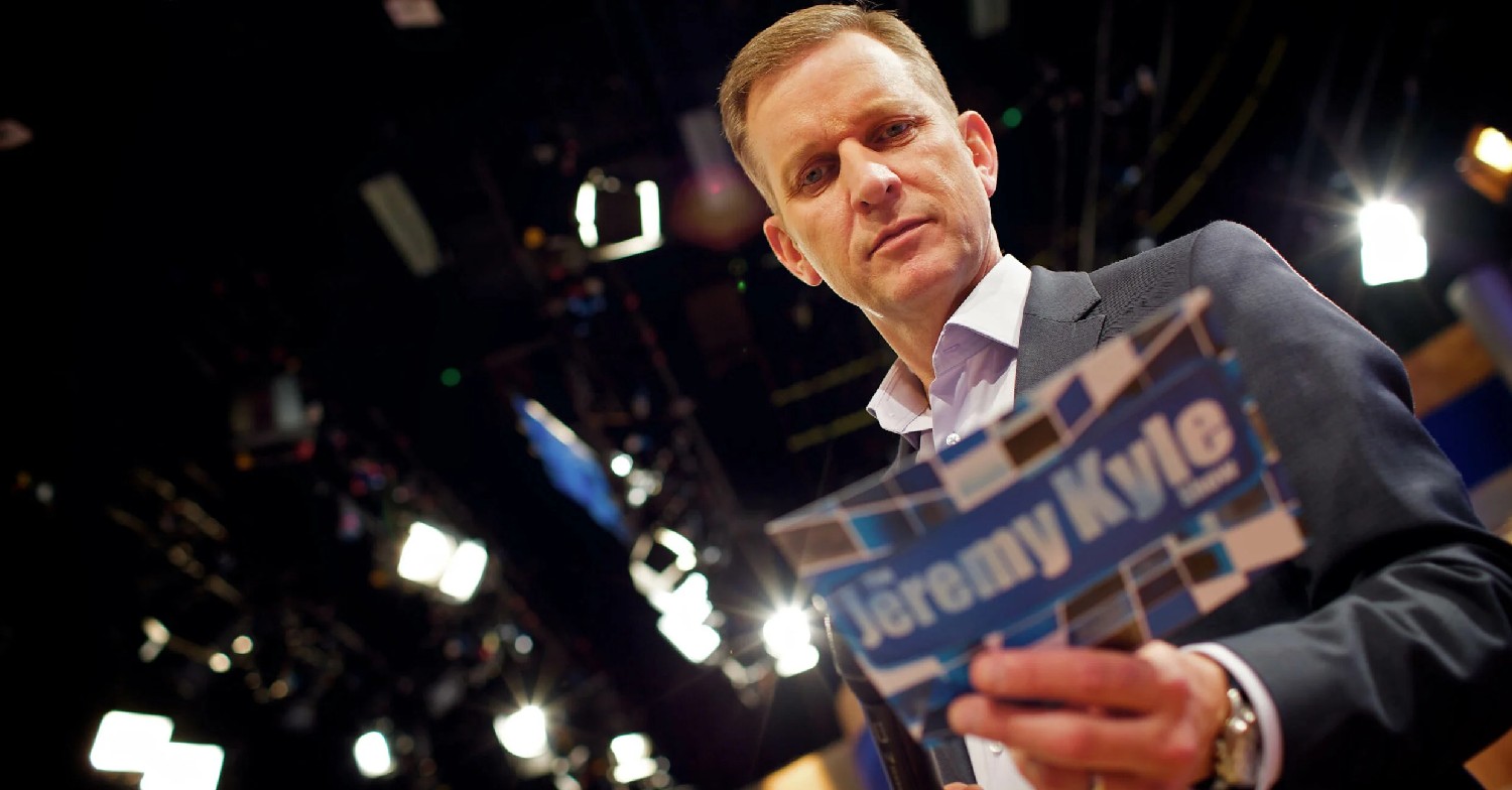 Jeremy Kyle holding up cards on The Jeremy Kyle Show