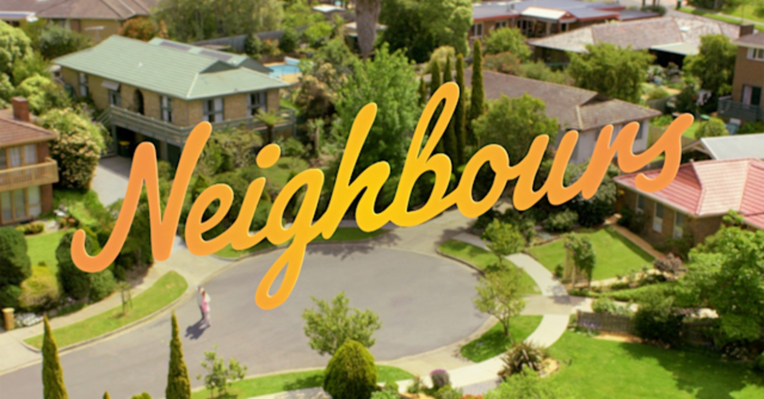 Neighbours logo, set against arial view of Ramsay Street (Credit: Channel 5/Freevee)