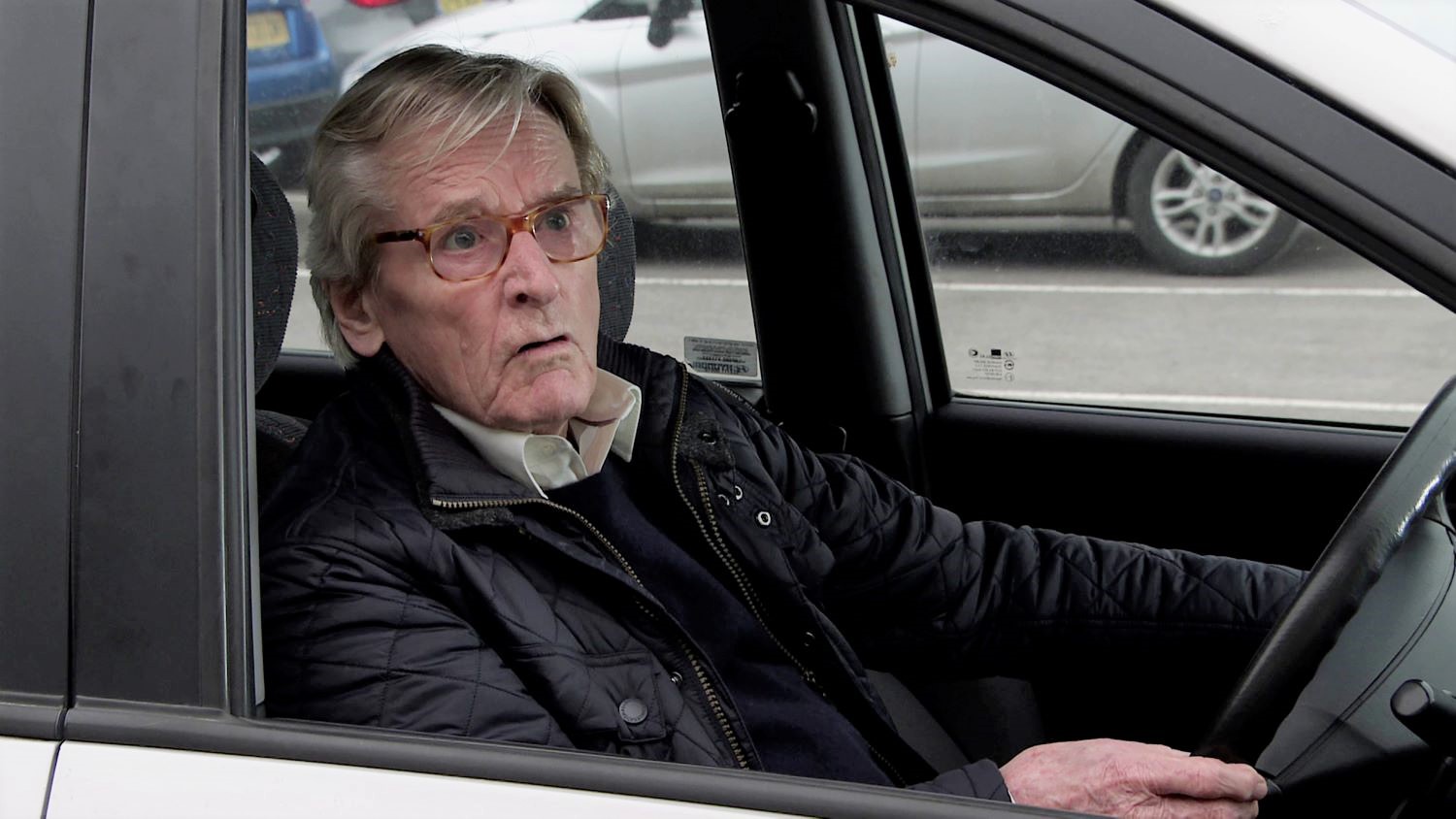 Ken Barlow looking shocked in a car in Coronation Street 