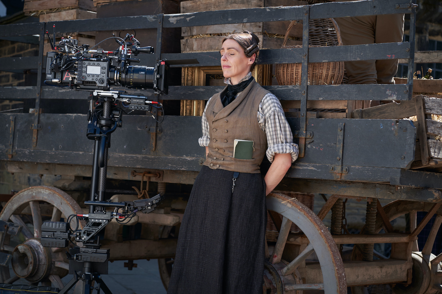 Anne Lister of Gentleman Jack leaning on a cart