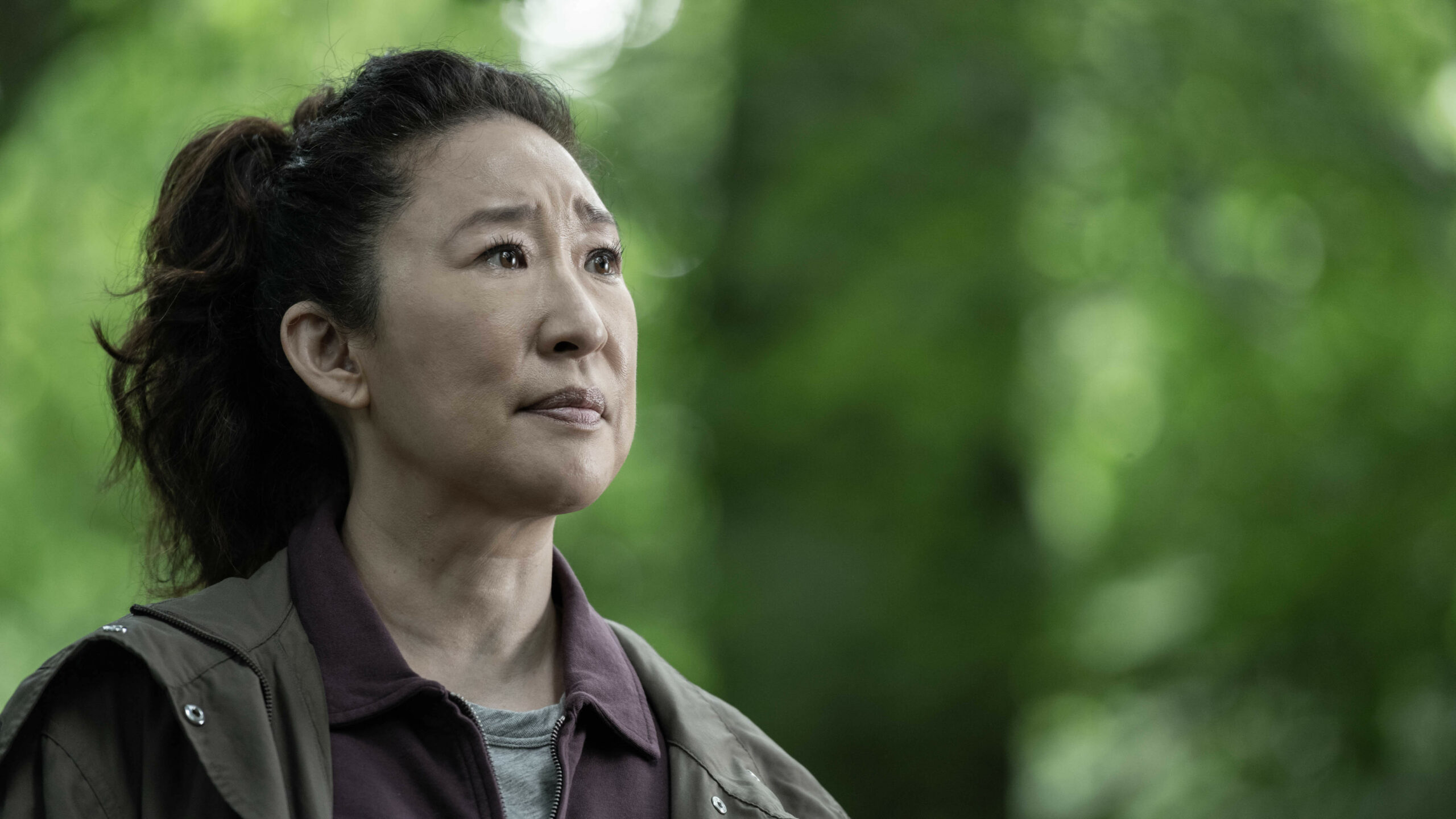 Eve looking up in the woods in Killing Eve