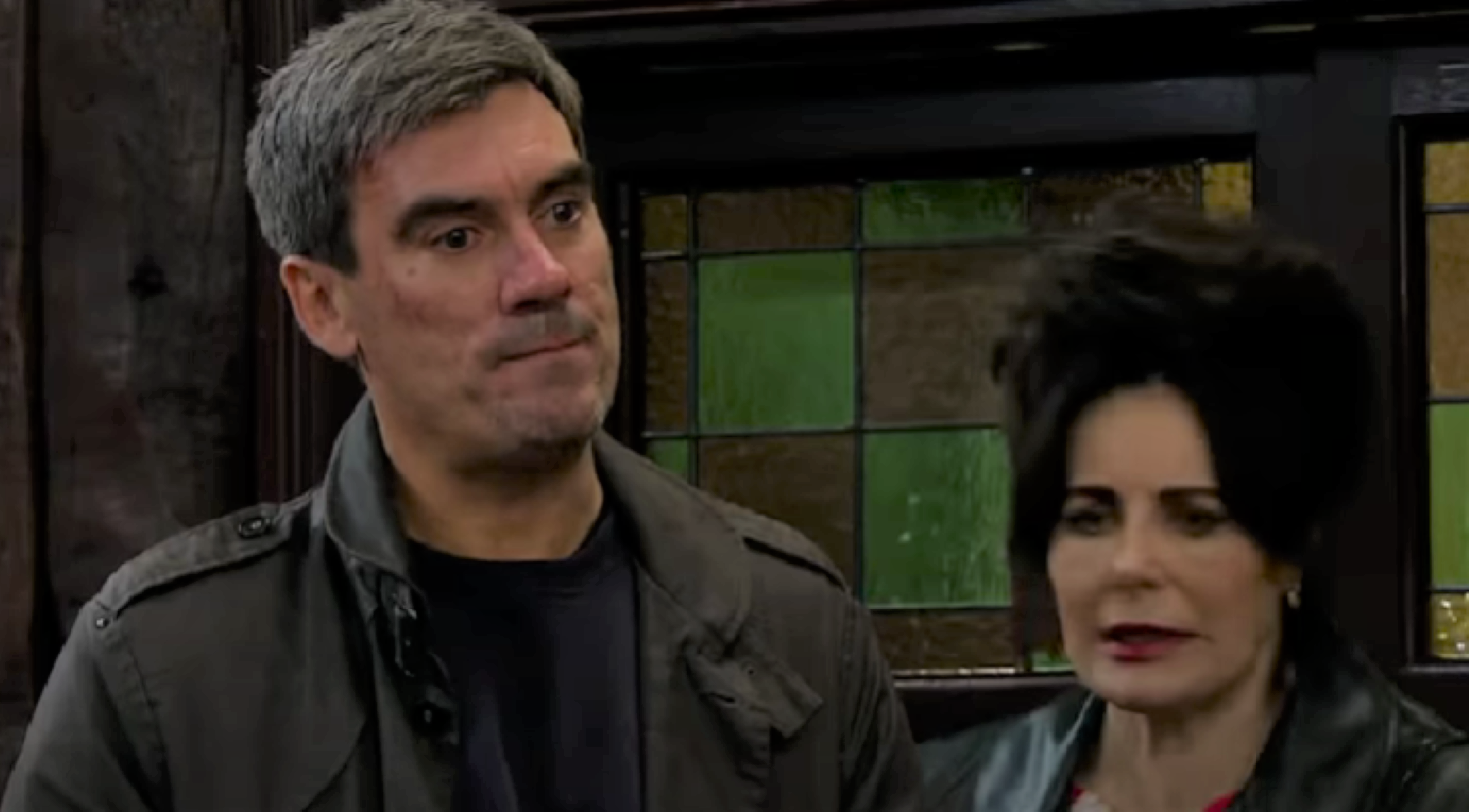 Cain looks annoyed as Faith looks worried in Emmerdale