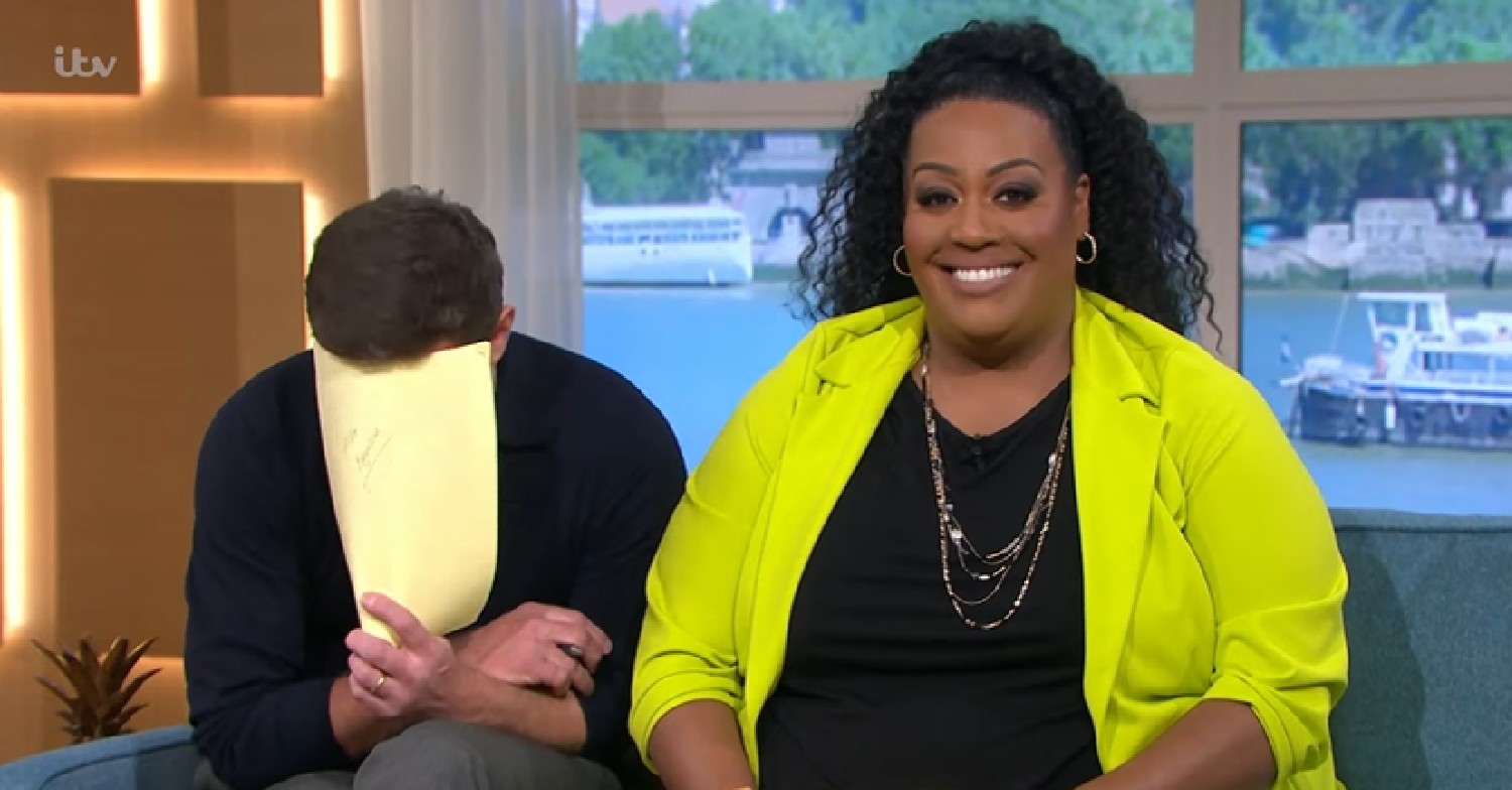 Dermot O'Leary covering face with script alongside Alison Hammond on This Morning today April 22, 2022
