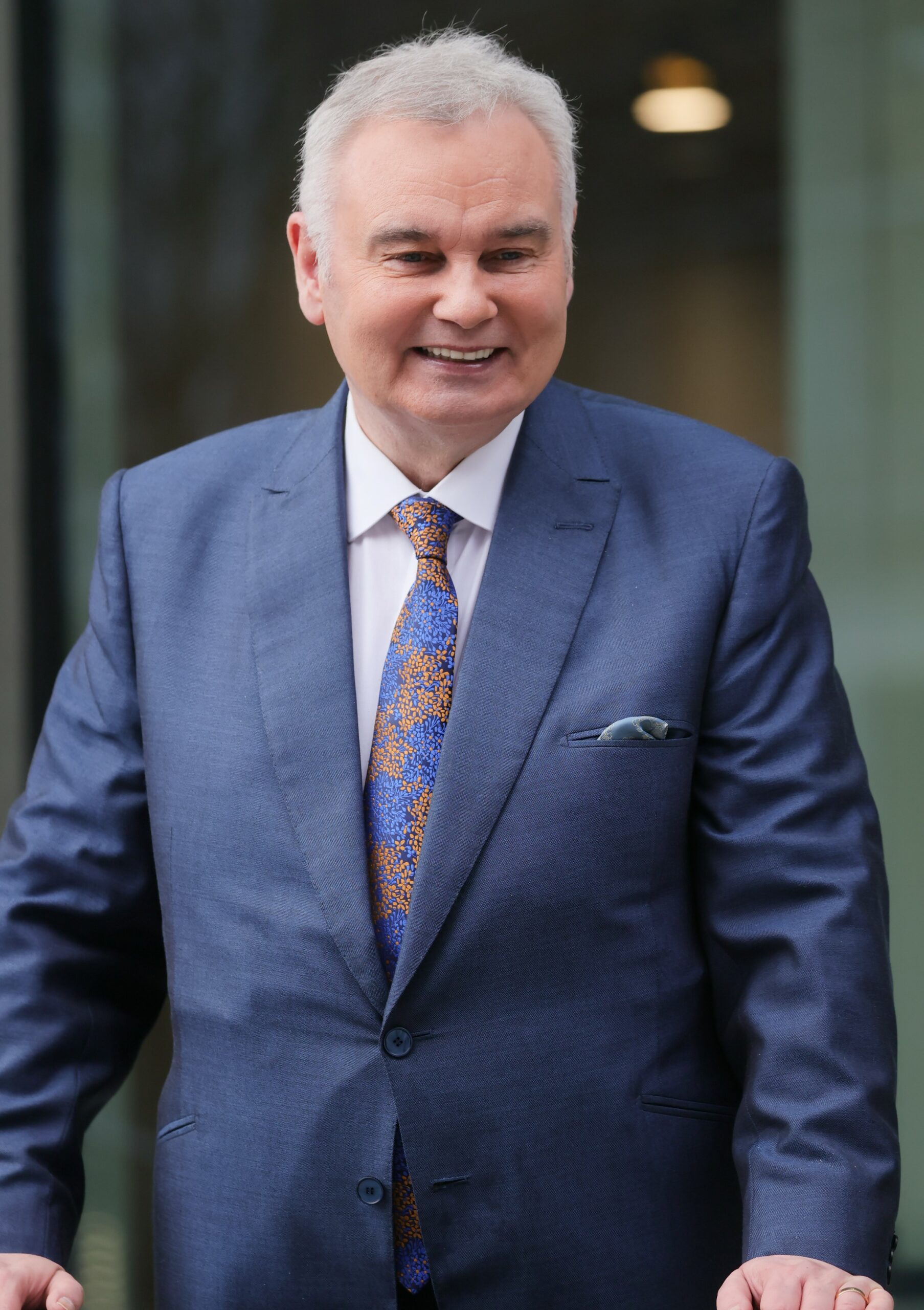 Eamonn Holmes smiles in suit after first day on GB News