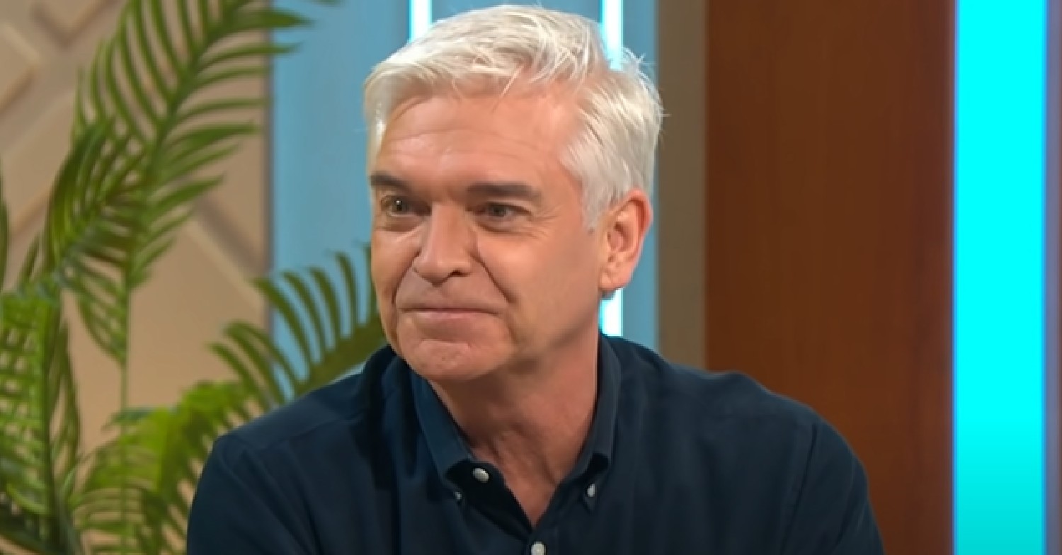 Phillip Schofield smiles in navy shirt on Lorraine