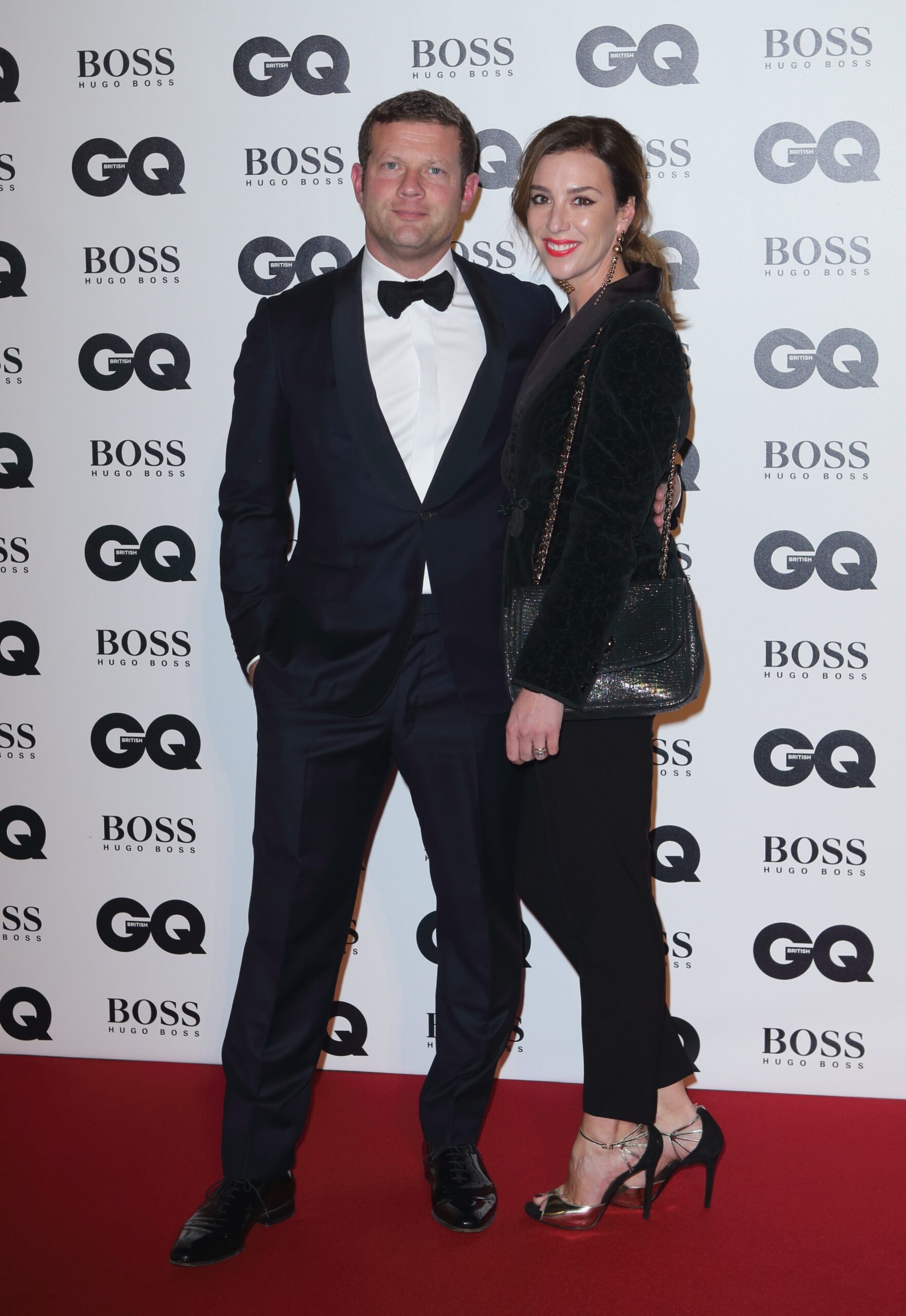 Dermot O'Leary and his wife smiling at an awards do