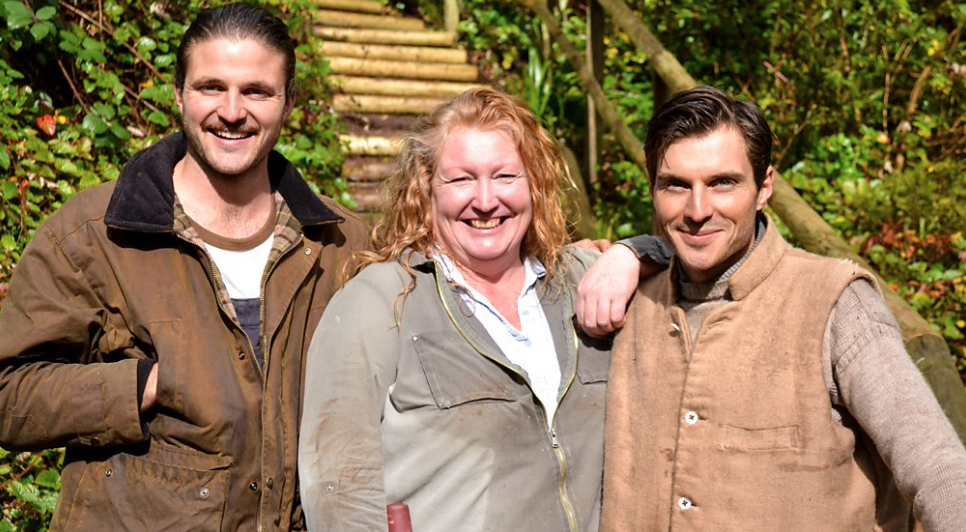 Charlie Dimmock smiling with the Rich Brothers on Garden Rescue