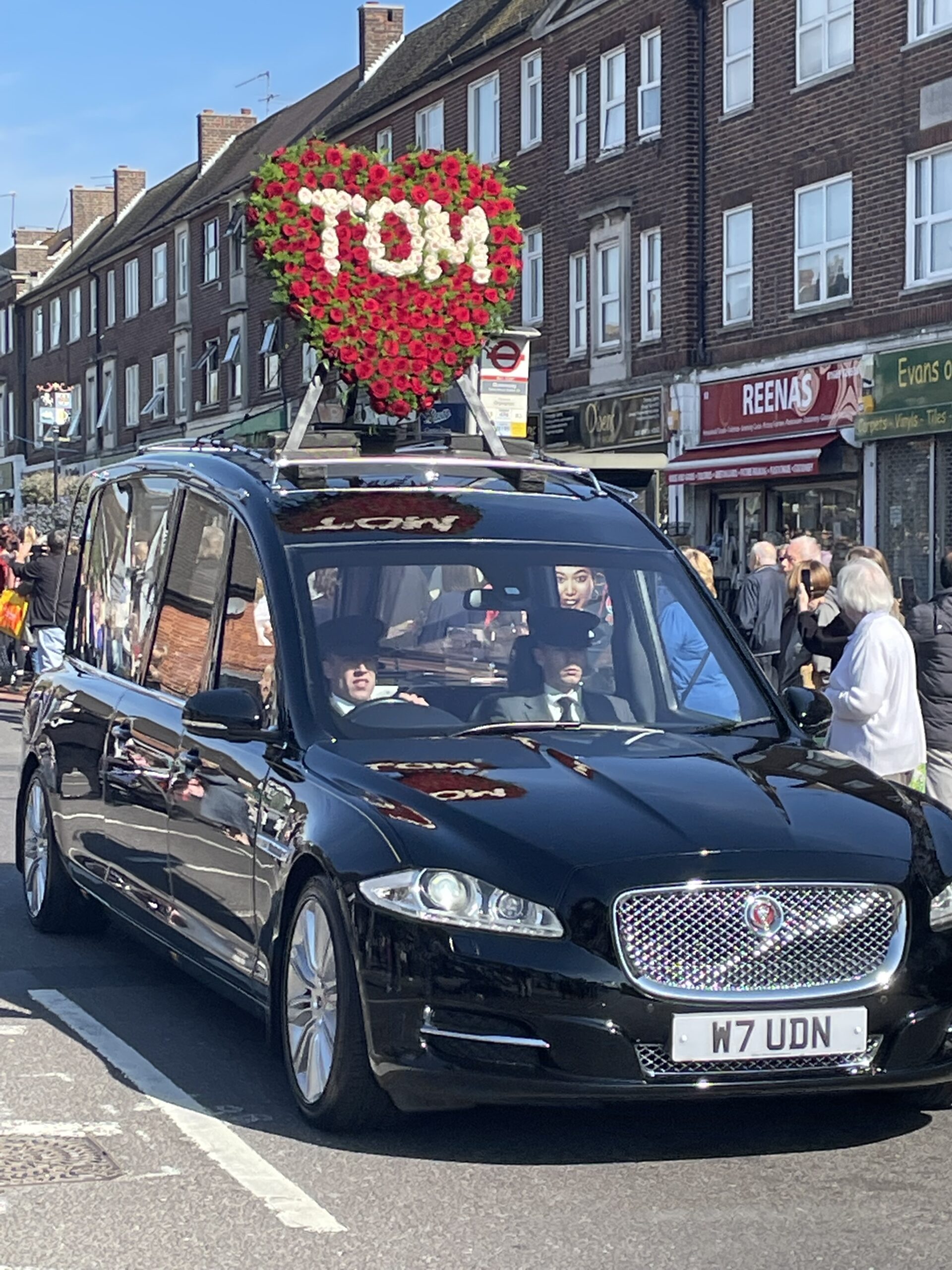 Tom Parker's funeral car with heart floral tribute