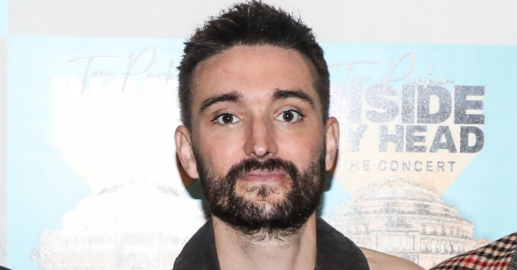 The Wanted's Tom Parker on the red carpet looking straight at the camera