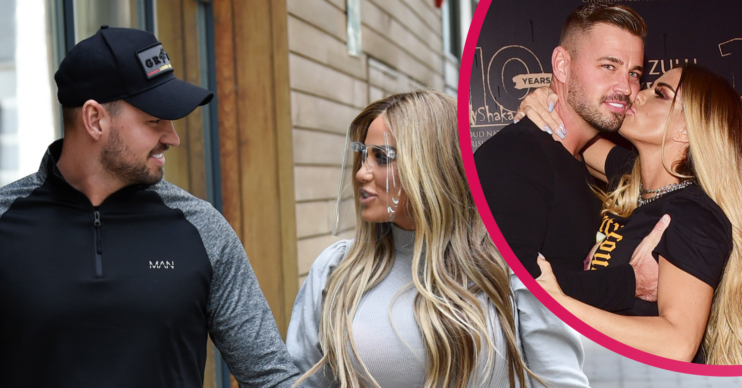Katie Price and Carl Woods together cuddle up to each other