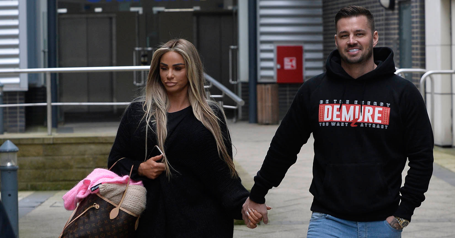 Katie Price walking hand in hand with Carl Woods