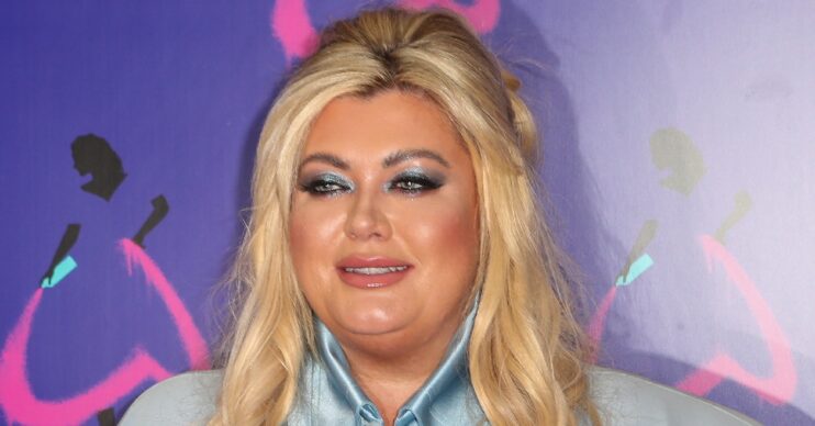 Gemma Collins smiling in blue shirt and makeup for event