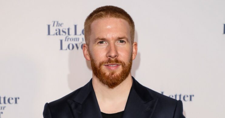 Strictly star Neil Jones with a shaved head on the red carpet