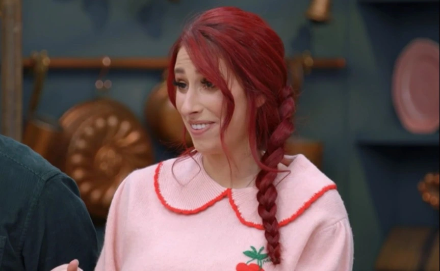 Stacey Solomon on Bake Off in a pink jumper