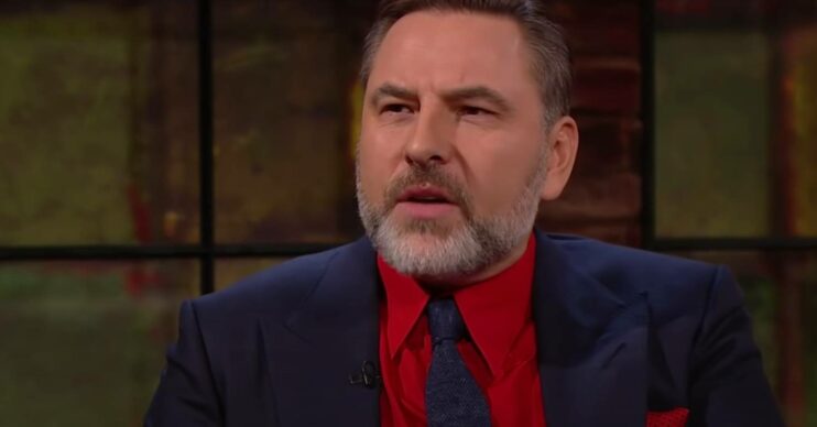 BGT star David Walliams looking confused in a red shirt