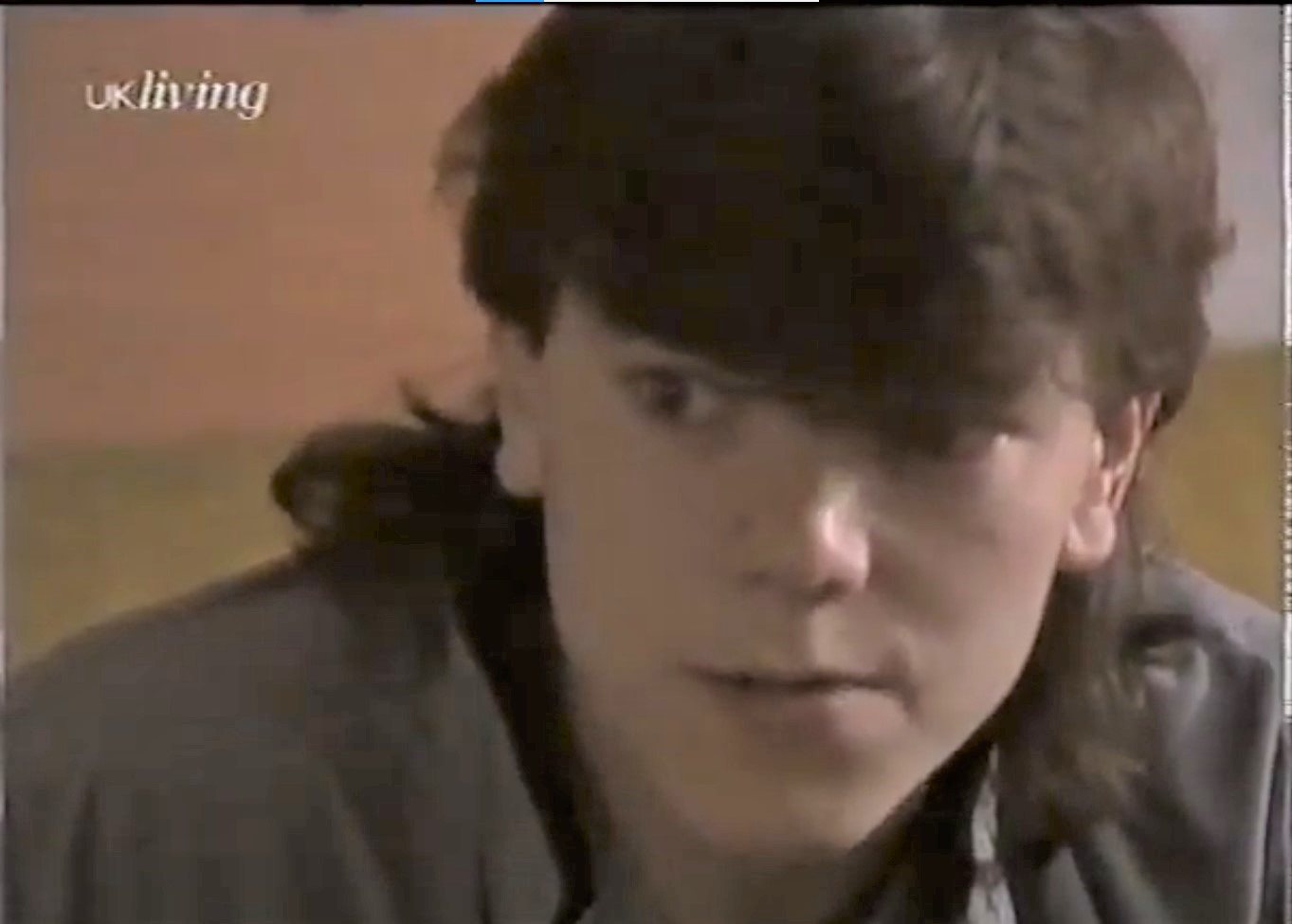 Damon Grant looks worried in Brookside