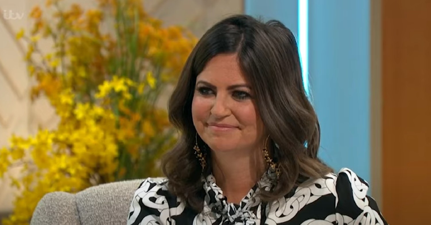 Deborah James smiling in black and white patterend blouse on Lorraine