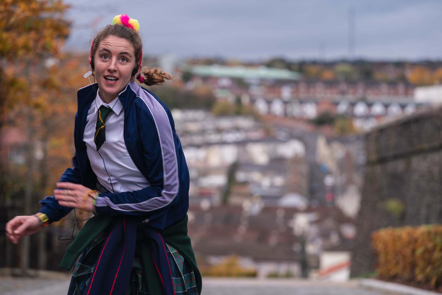 Derry Girls' Orla running with an inane grin on her face