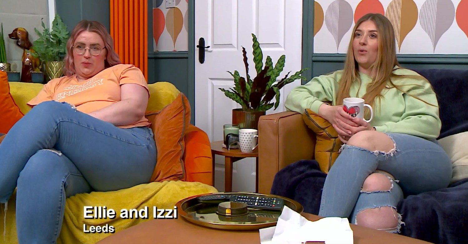 Ellie Warner sitting in her living room with sister Izzi on Gogglebox