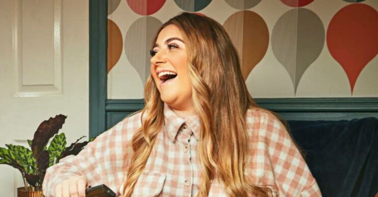 Gogglebox star Izzi Warner opens her mouth wide as she laughs