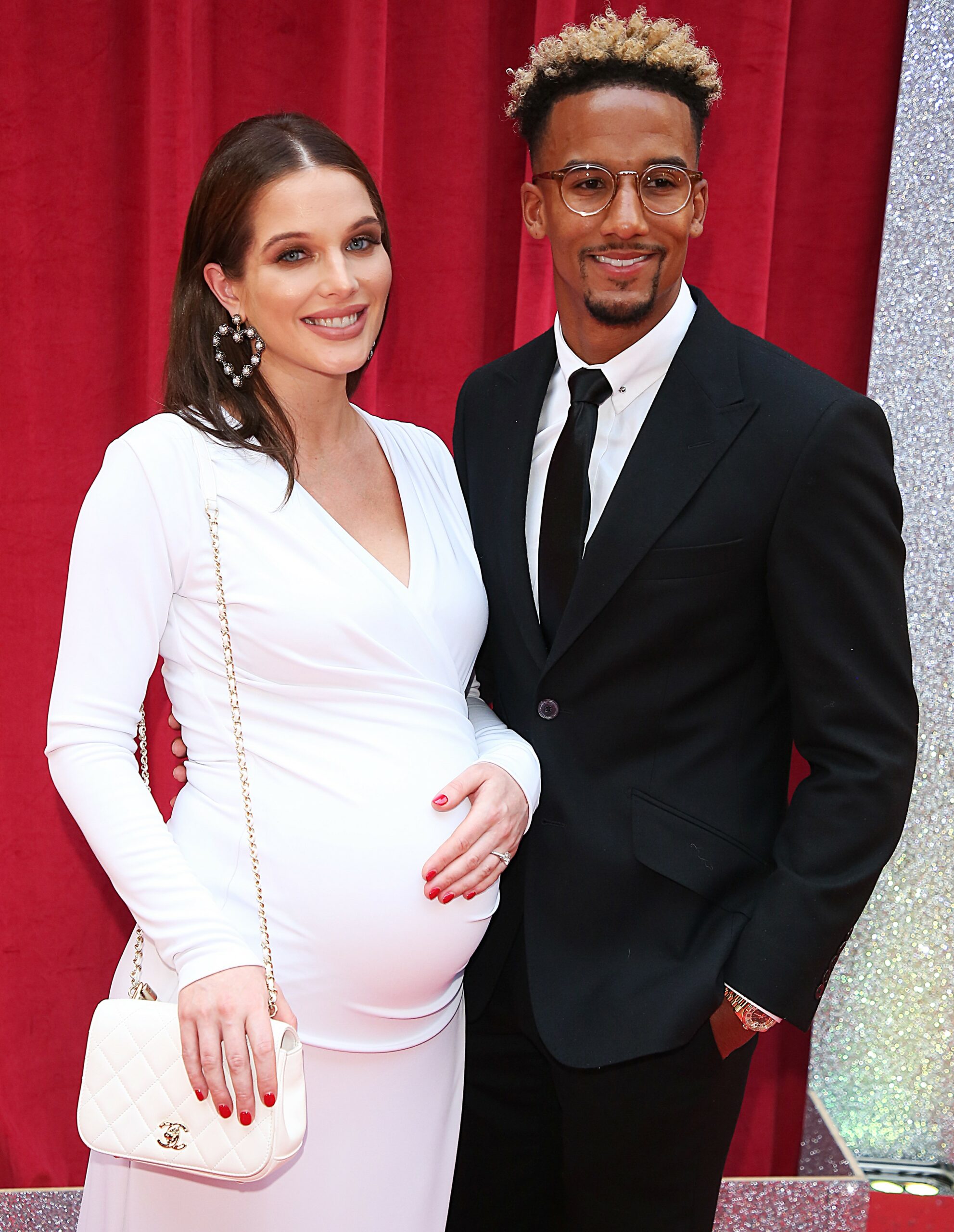 Helen Flanagan in white dress alongside Scott Sinclair