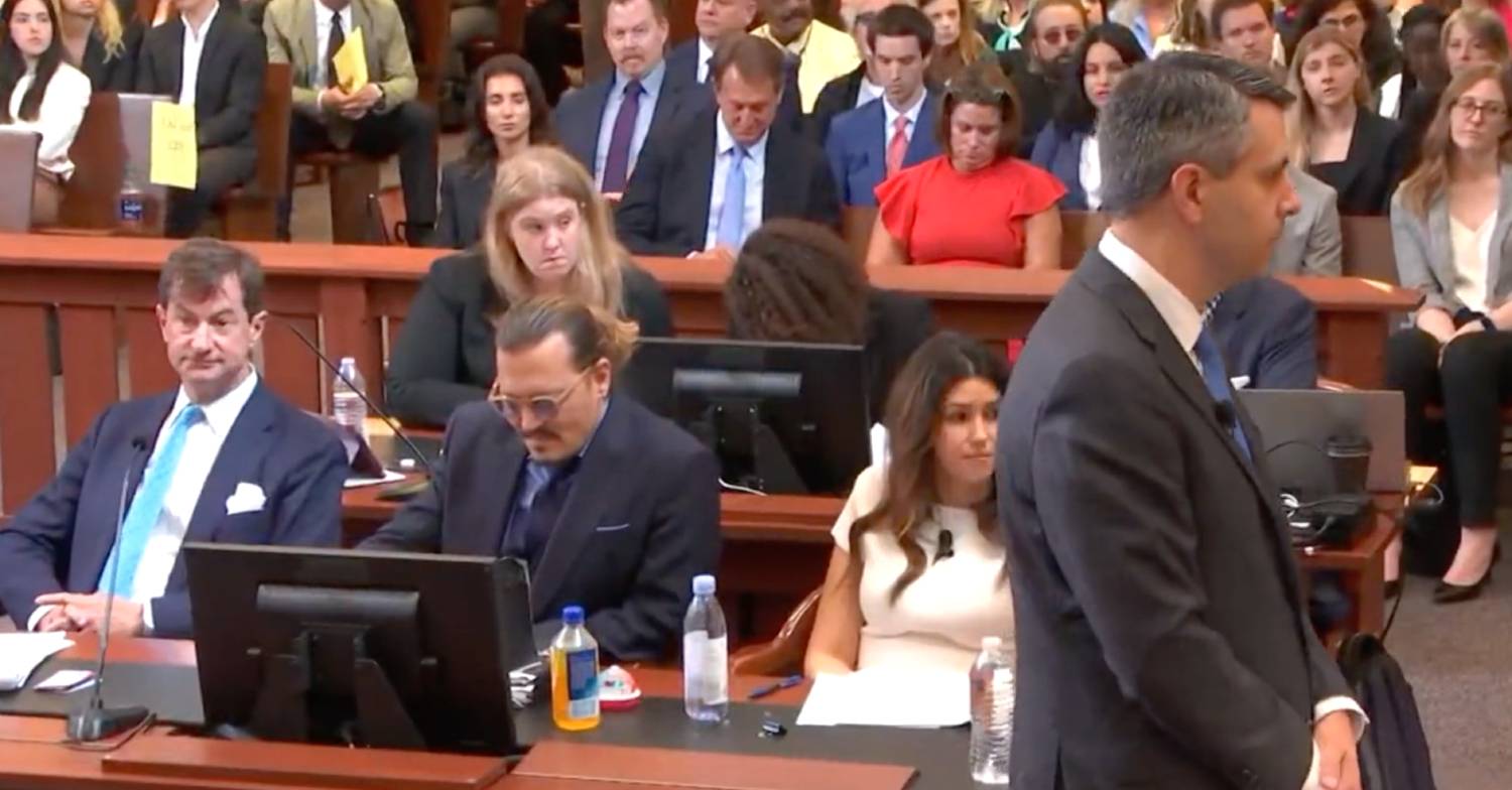 Johnny Depp looks down as Amber Heard lawyer makes his closing argument