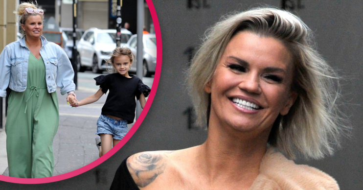 Kerry Katona smiling and with her daughter DJ