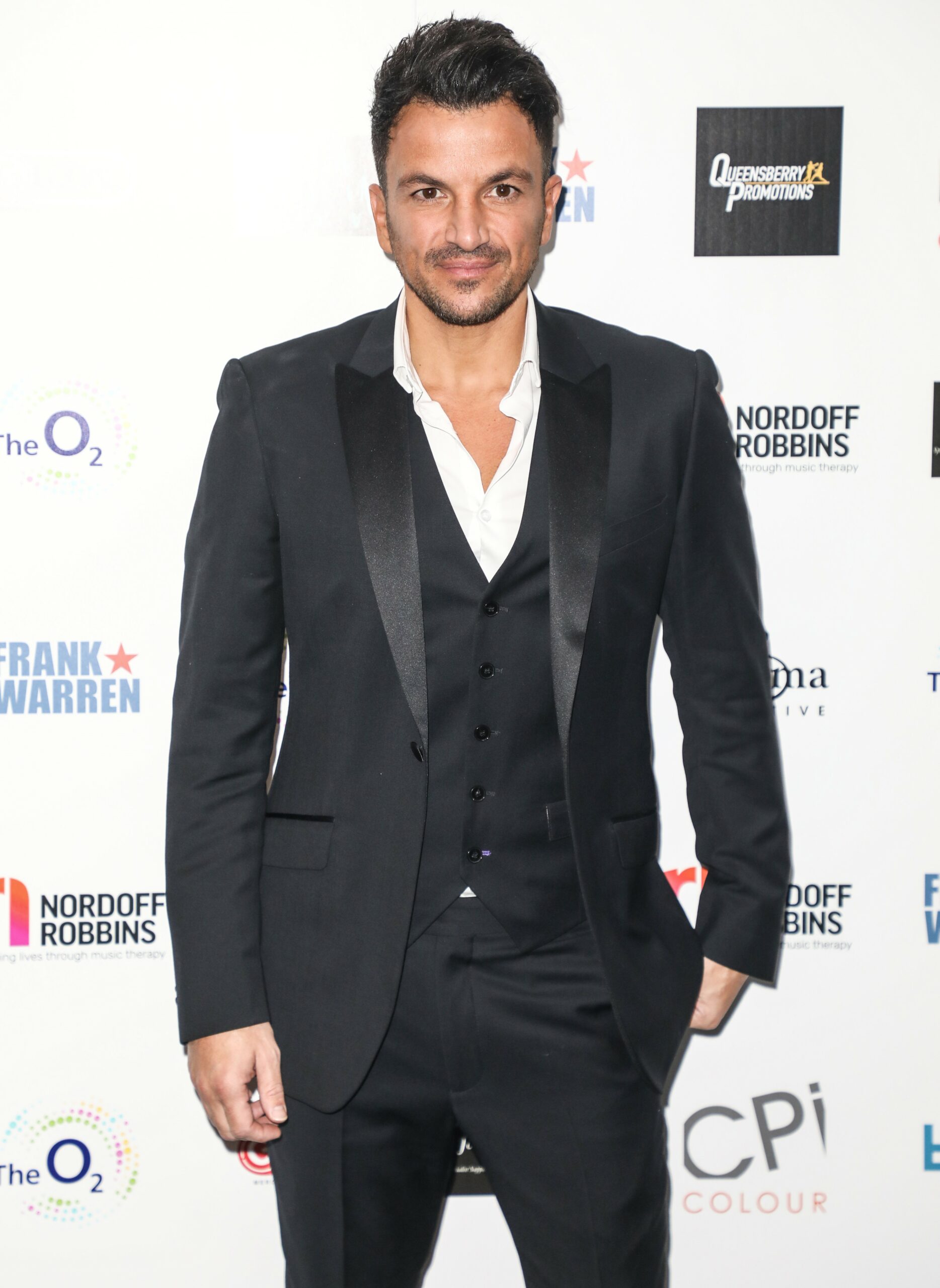 Peter Andre in black suit at event