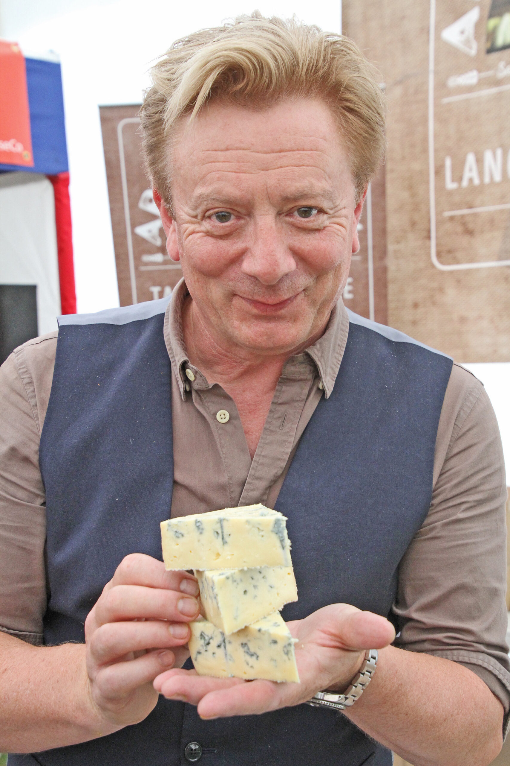 Sean Wilson poses with his cheese block