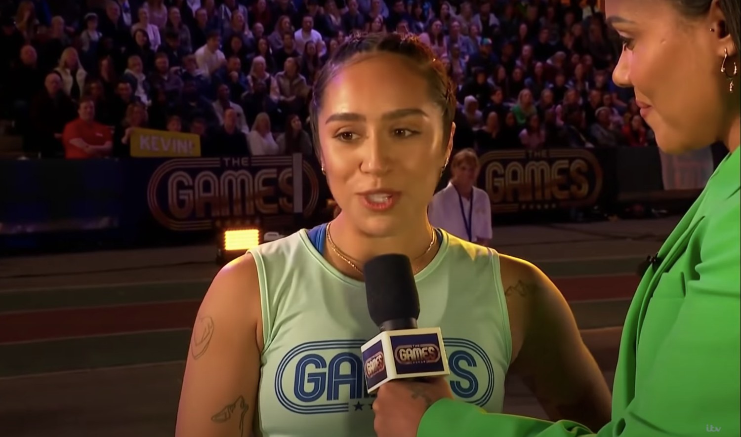 Chelcee Grimes in a green t-shirt on The Games