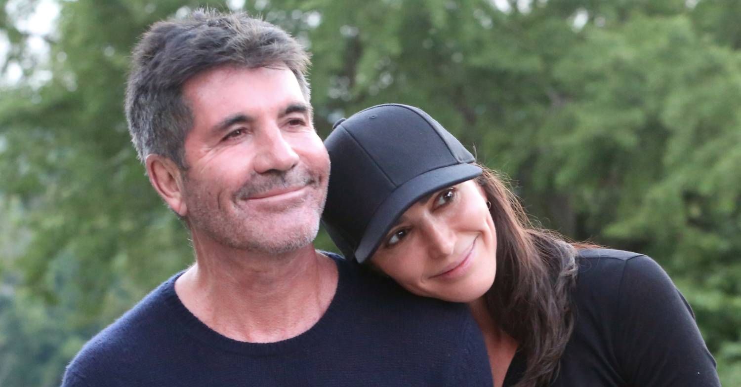 Lauren Silverman rests her head on Simon Cowell's shoulder